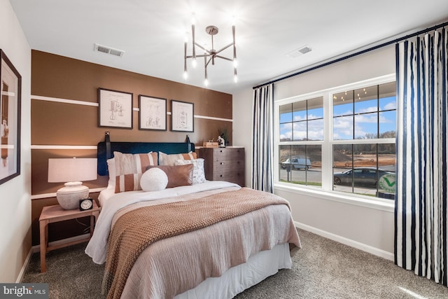 bedroom with carpet and a notable chandelier