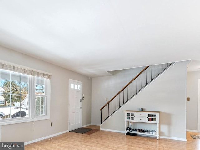 foyer with light hardwood / wood-style floors