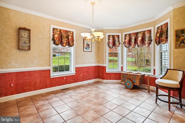 unfurnished room featuring tile patterned floors, crown molding, and a notable chandelier