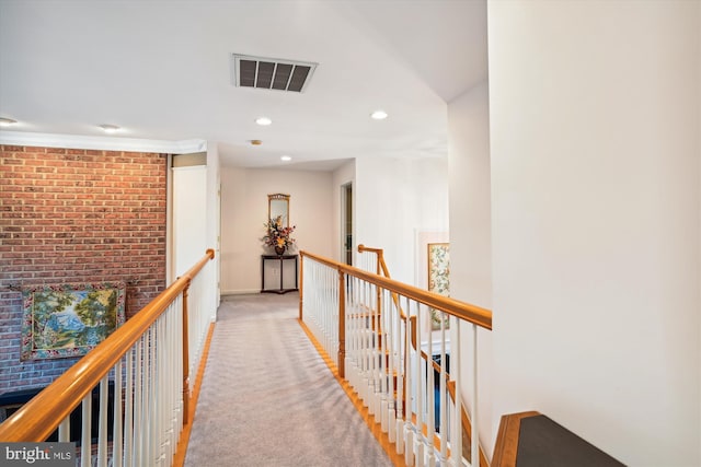 corridor featuring light colored carpet