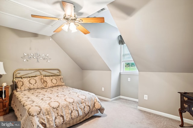 carpeted bedroom with vaulted ceiling and ceiling fan