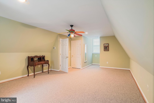 additional living space featuring light carpet, ceiling fan, and lofted ceiling