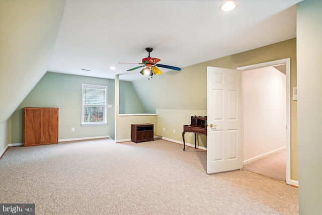 additional living space featuring carpet flooring, ceiling fan, and lofted ceiling