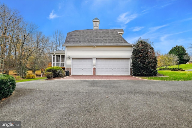 view of side of property featuring a garage