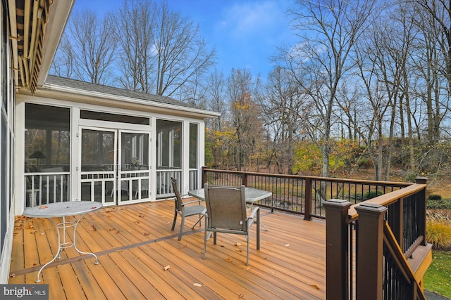 wooden terrace with a sunroom