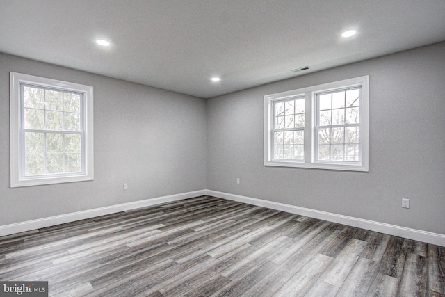 unfurnished room featuring hardwood / wood-style floors