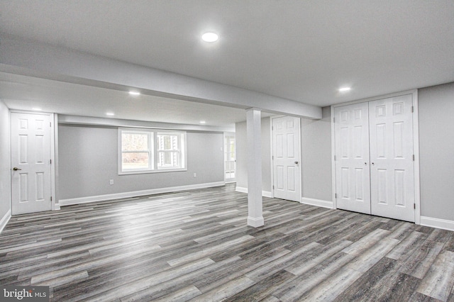 basement featuring dark hardwood / wood-style floors