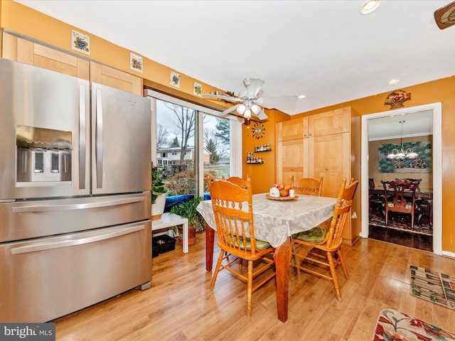 dining room featuring light wood-type flooring and ceiling fan