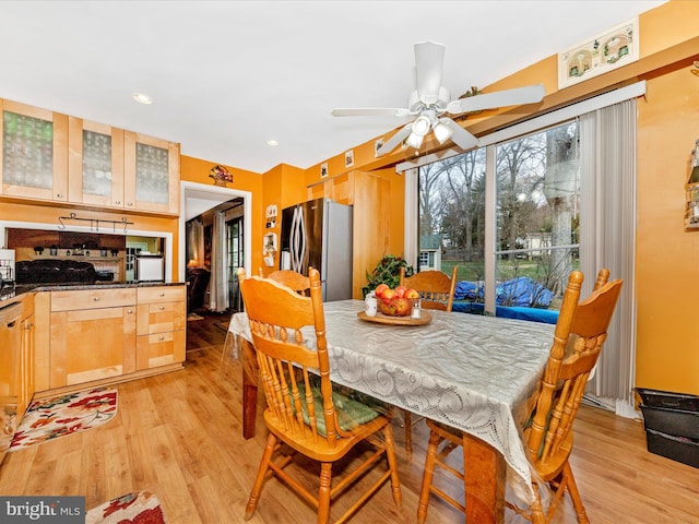 dining area featuring ceiling fan and light wood-type flooring