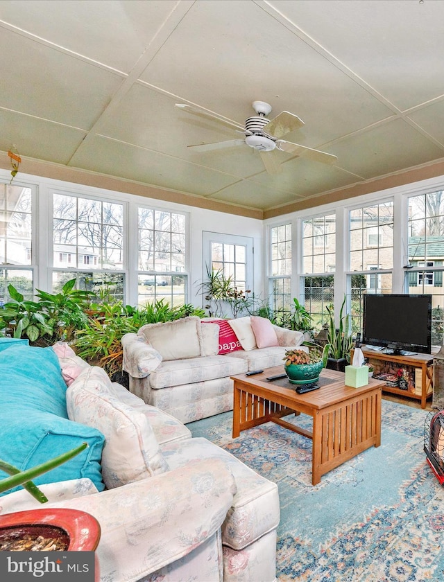 sunroom / solarium with ceiling fan