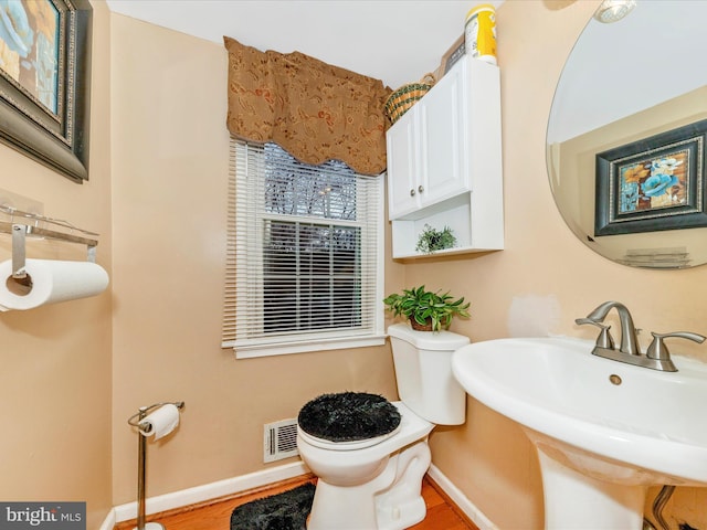 bathroom with toilet and sink