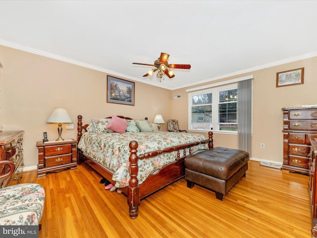 bedroom featuring light wood-type flooring, ceiling fan, and ornamental molding