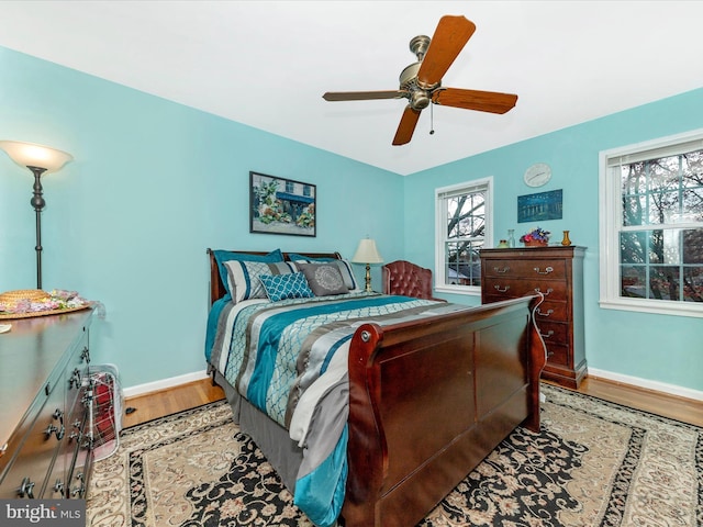 bedroom with hardwood / wood-style floors and ceiling fan