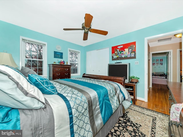 bedroom featuring wood-type flooring and ceiling fan