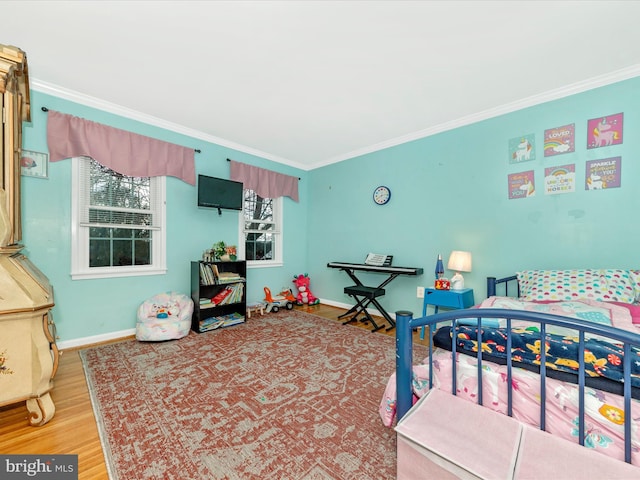 bedroom featuring hardwood / wood-style flooring and crown molding