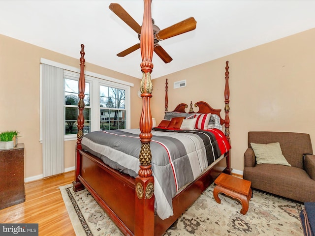 bedroom with light wood-type flooring and ceiling fan