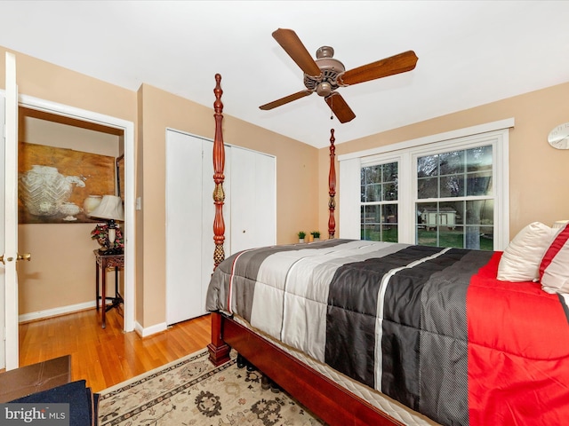 bedroom with ceiling fan and light wood-type flooring