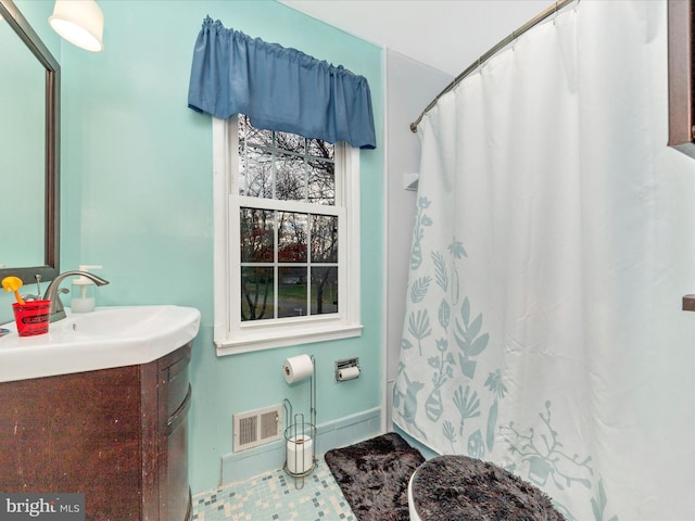 bathroom featuring a shower with shower curtain, vanity, and tile patterned floors