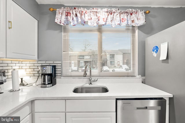 8111 Bird Ln, Greenbelt, MD 20770 - kitchen featuring appliances with stainless steel finishes, white cabinetry, and tasteful backsplash