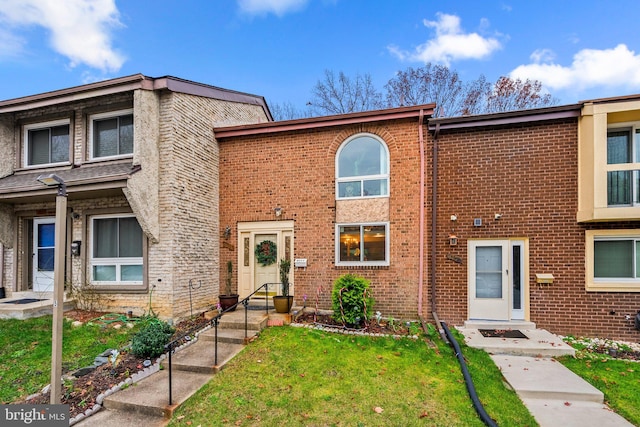 8111 Bird Ln, Greenbelt, MD 20770 - view of property featuring a front yard and brick siding