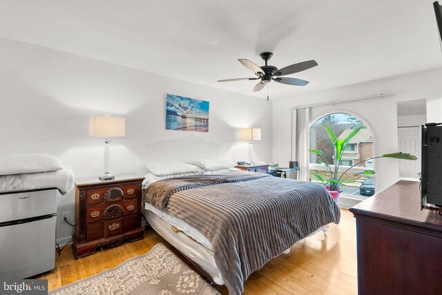 8111 Bird Ln, Greenbelt, MD 20770 - bedroom with access to outside, light wood-style floors, and ceiling fan