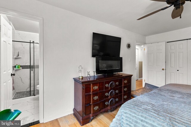 8111 Bird Ln, Greenbelt, MD 20770 - bedroom with wood finished floors, ceiling fan, a closet, and ensuite bathroom