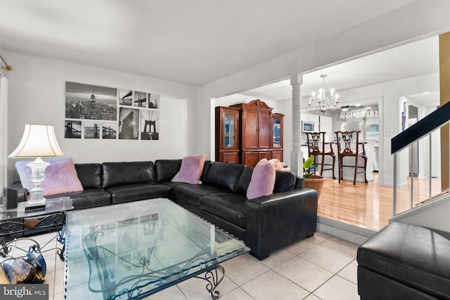 8111 Bird Ln, Greenbelt, MD 20770 - living room with light tile patterned flooring, a chandelier, and decorative columns