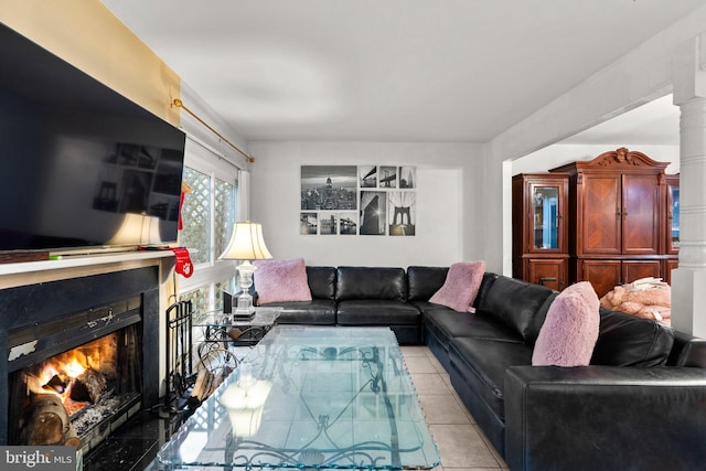 8111 Bird Ln, Greenbelt, MD 20770 - living room featuring a lit fireplace and light tile patterned floors