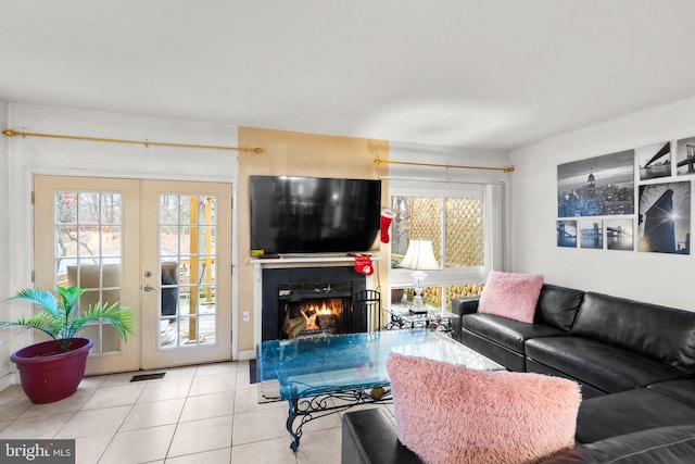 8111 Bird Ln, Greenbelt, MD 20770 - living area featuring tile patterned flooring, french doors, and a warm lit fireplace