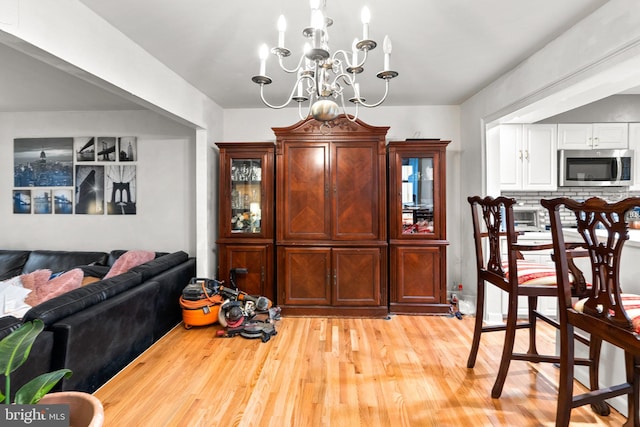 8111 Bird Ln, Greenbelt, MD 20770 - dining space featuring a chandelier and light wood finished floors