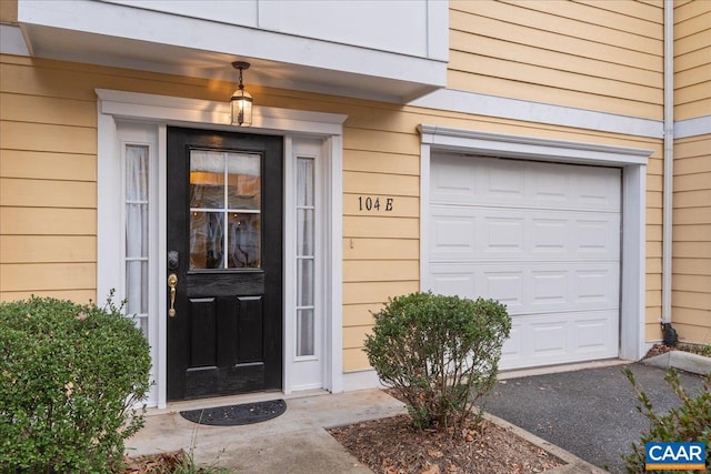 property entrance with a garage