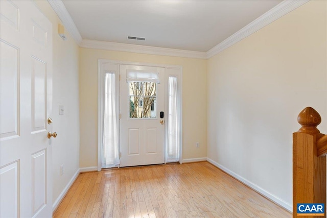 entrance foyer with light wood-type flooring and ornamental molding