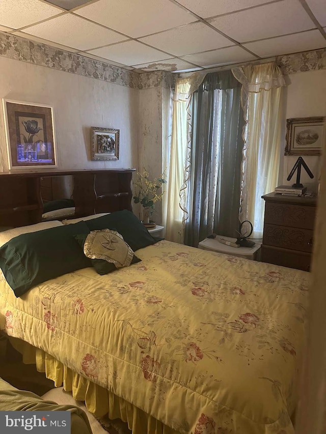 bedroom featuring a paneled ceiling