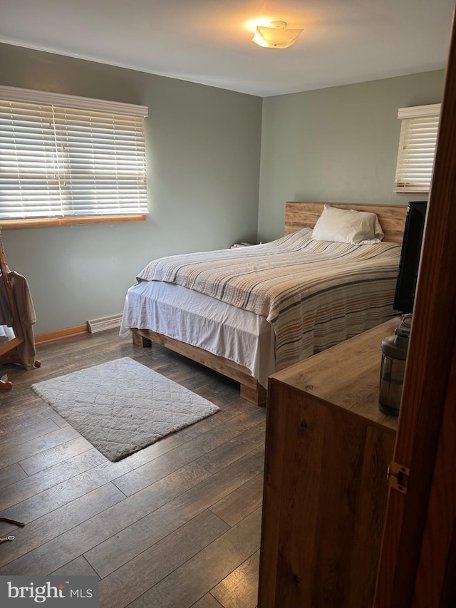 bedroom featuring dark hardwood / wood-style flooring