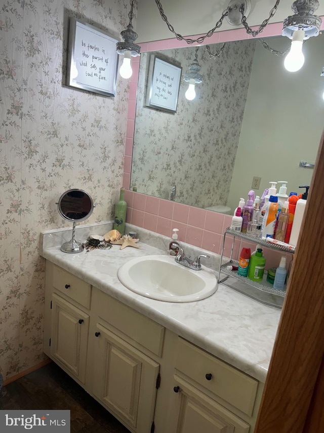 bathroom with wood-type flooring and vanity