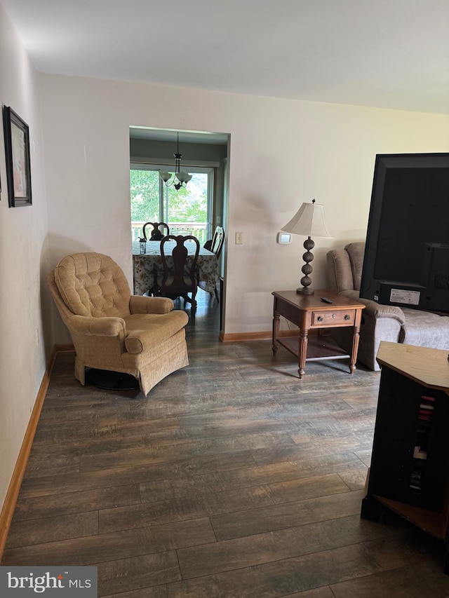 sitting room featuring dark hardwood / wood-style flooring