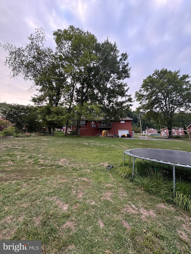 view of yard featuring a trampoline