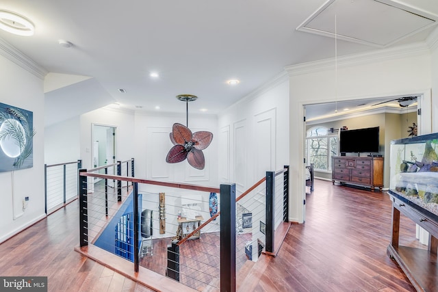 hall featuring hardwood / wood-style flooring and crown molding