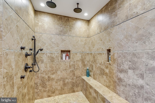 bathroom with tiled shower