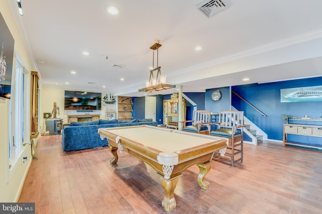 playroom featuring hardwood / wood-style flooring, crown molding, and pool table