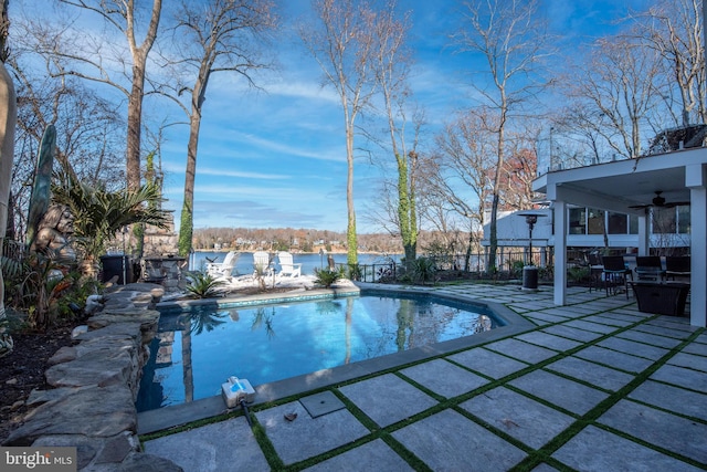 view of pool featuring ceiling fan and a patio