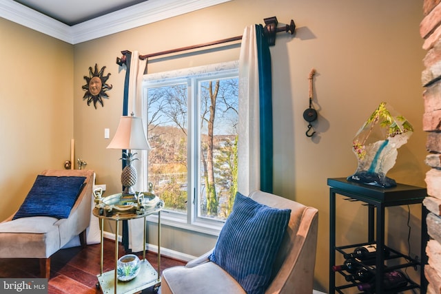 living area with a healthy amount of sunlight, dark hardwood / wood-style flooring, and crown molding