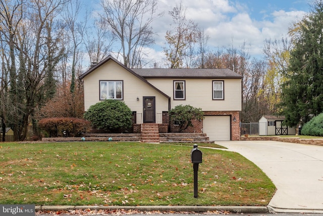 bi-level home with a garage, a front lawn, and a storage shed