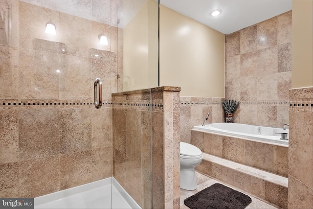 bathroom with separate shower and tub, toilet, and tile walls