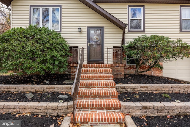 doorway to property featuring a garage