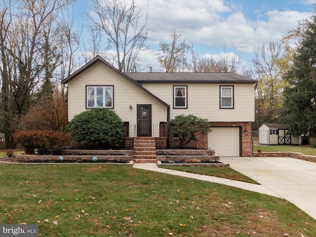 raised ranch featuring a storage shed, a front lawn, and a garage