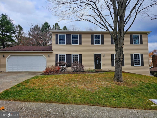 colonial-style house with a garage and a front yard