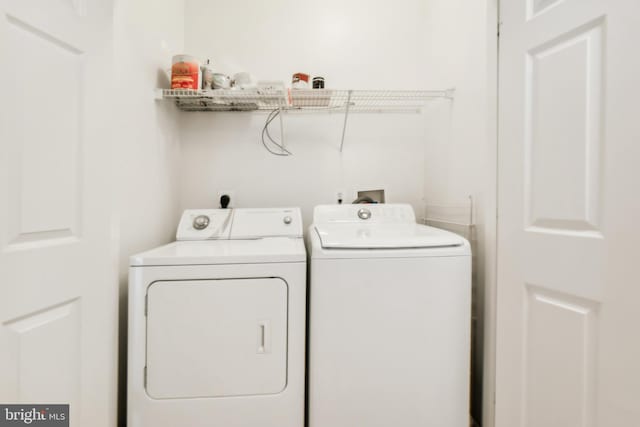 laundry room featuring washer and clothes dryer