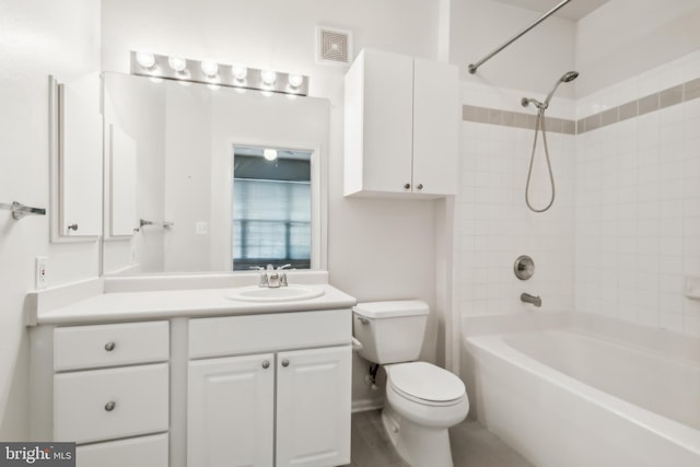 full bathroom featuring vanity, toilet, and tiled shower / bath combo