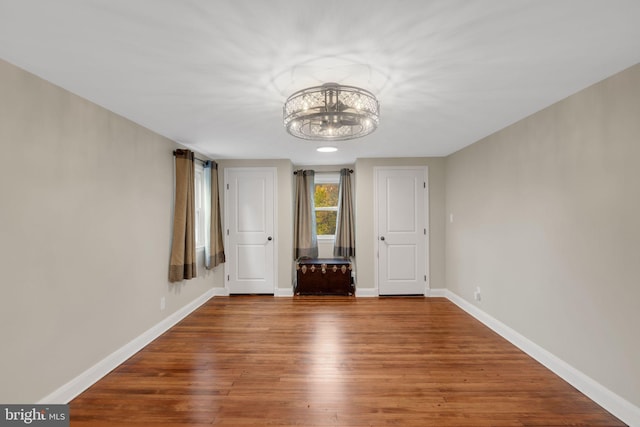 unfurnished bedroom with hardwood / wood-style flooring